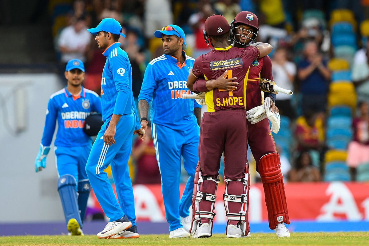 Shai Hope and Keacy Carty of West Indies celebrate as Shubman Gill and Suryakumar Yadav of India walk off the field at the end of the 2nd ODI between West Indies and India at Kensington Oval in Bridgetown, Barbados on 29 July 2023