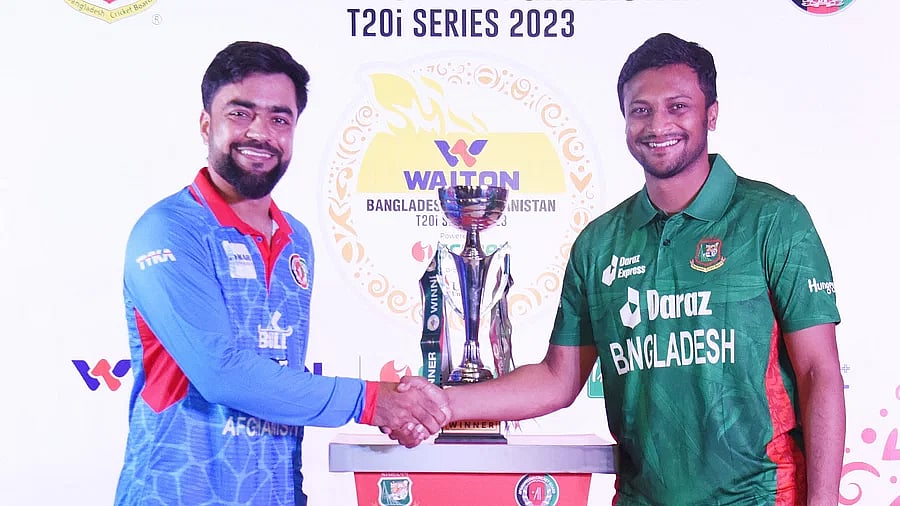Bangladesh T20 captain Shakib Al Hasan and his Afghan counterpart Rashid Khan shake hands in the trophy unveiling ceremony ahead of the two-match Twenty20 series in Sylhet on 13 July 203