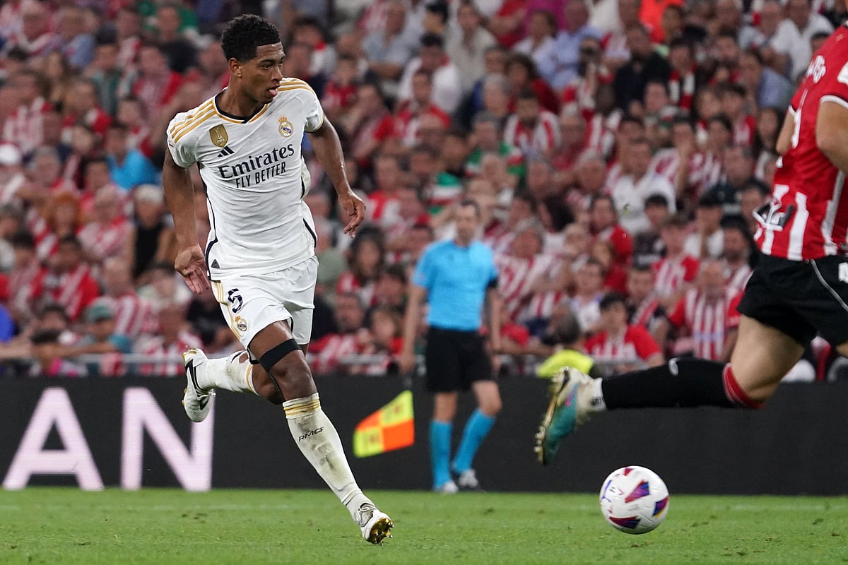 Real Madrid's English midfielder Jude Bellingham dribbles the ball during the La Liga match between Athletic Bilbao and Real Madrid at the San Mames stadium in Bilbao on 12 August 2023