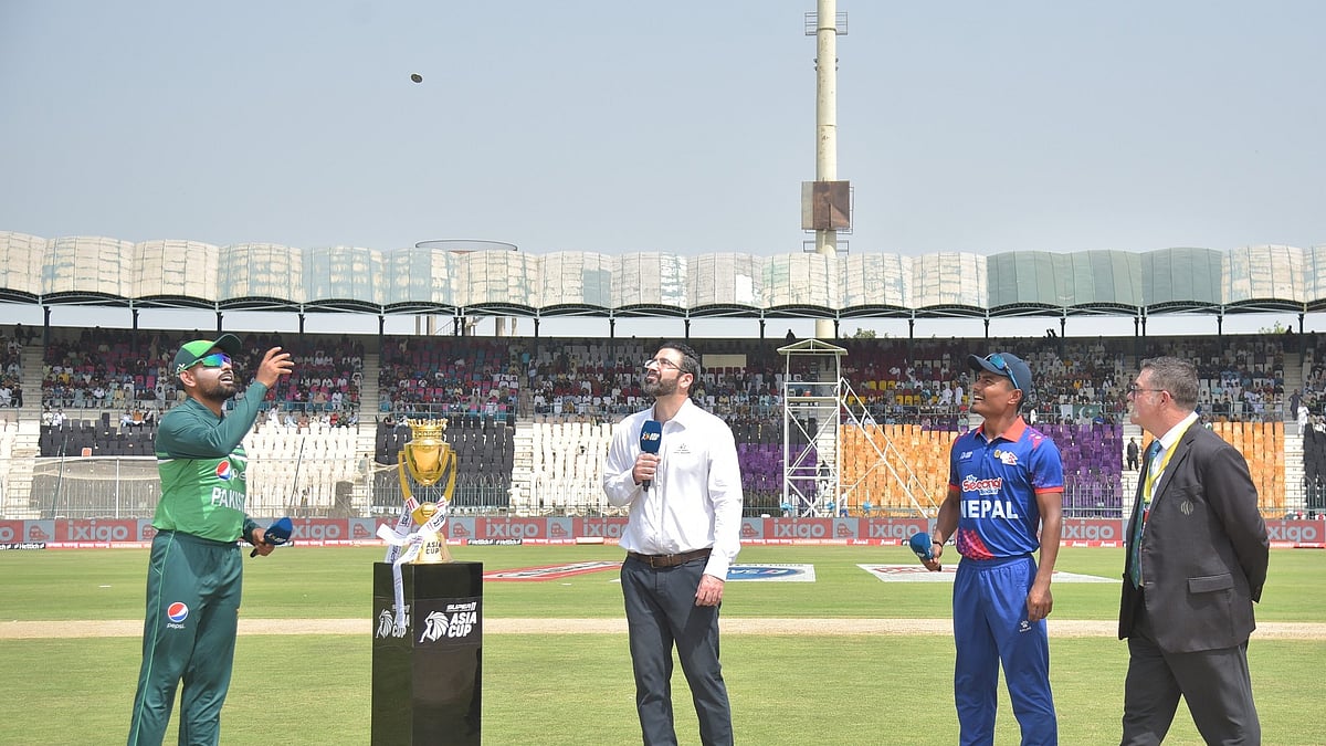 Pakistan captain Babar Azam and Sri Lanka captain Rohit Paudel during the toss ahead of their Asia Cup match at the Gaddafi Stadium in Lahore on 30 August 2023