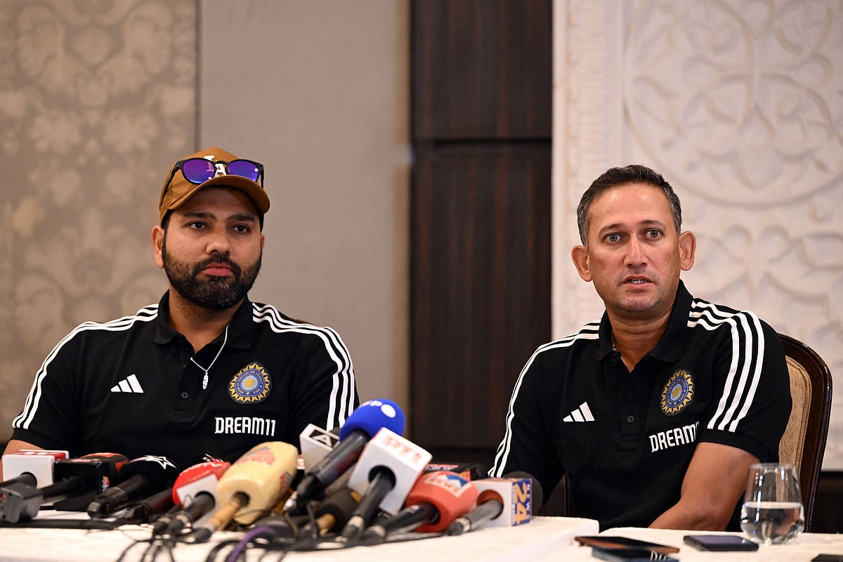 India's chief cricket selector Ajit Agarkar and player Rohit Sharma attend a press conference in New Delhi on 21 August 2023