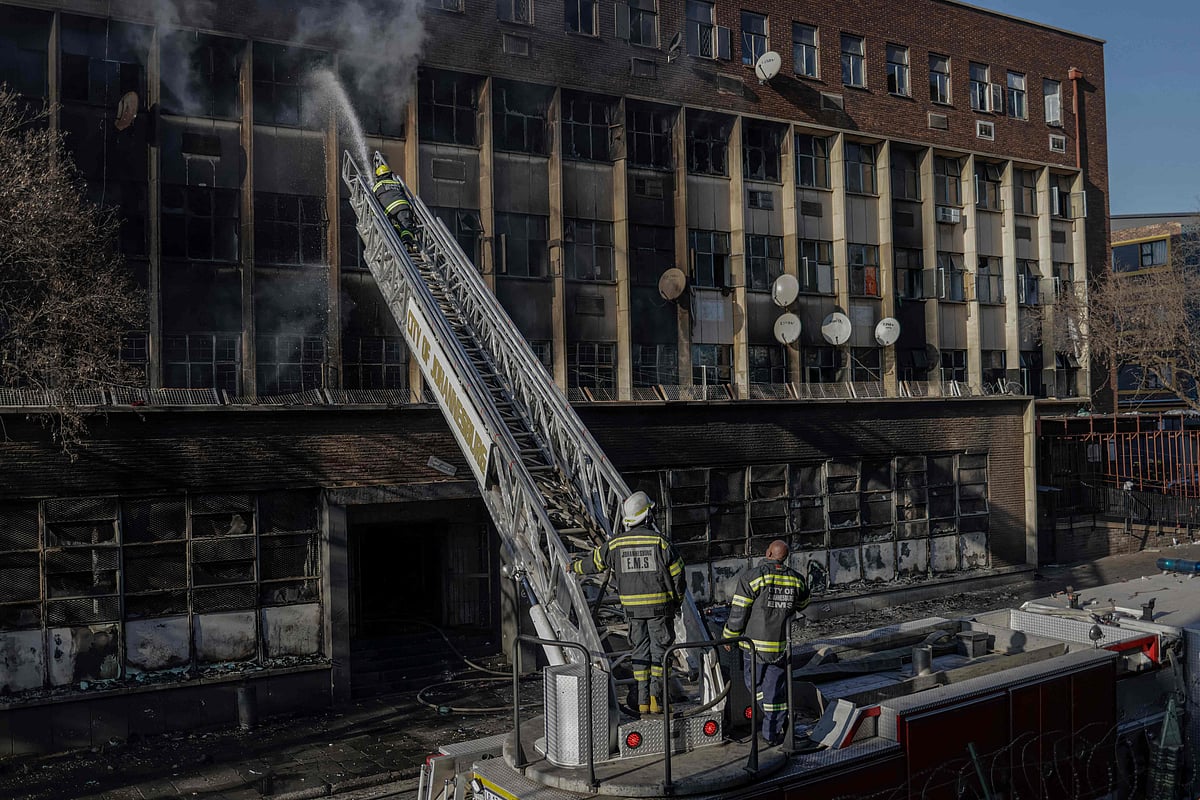 Firefighters extiguish a fire in a building in Johannesburg on 31 August, 2023