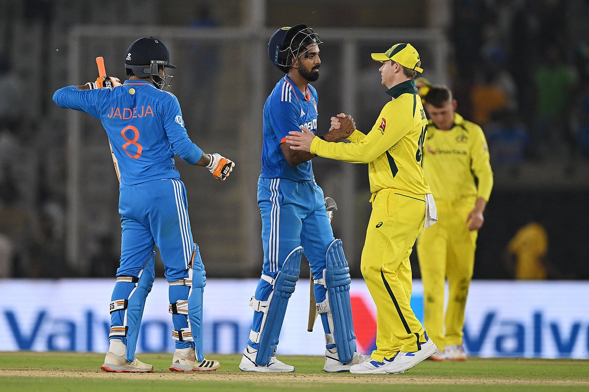 Australia's Steven Smith (R) congratulates India's KL Rahul (C) after India won the first one-day international (ODI) cricket match between India and Australia at the Punjab Cricket Association Stadium in Mohali on September 22, 2023
