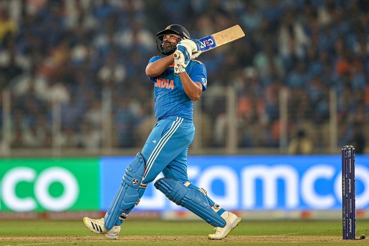India's captain Rohit Sharma plays a shot during the 2023 ICC Men's Cricket World Cup one-day international (ODI) match between India and Pakistan at the Narendra Modi Stadium in Ahmedabad on October 14, 2023.