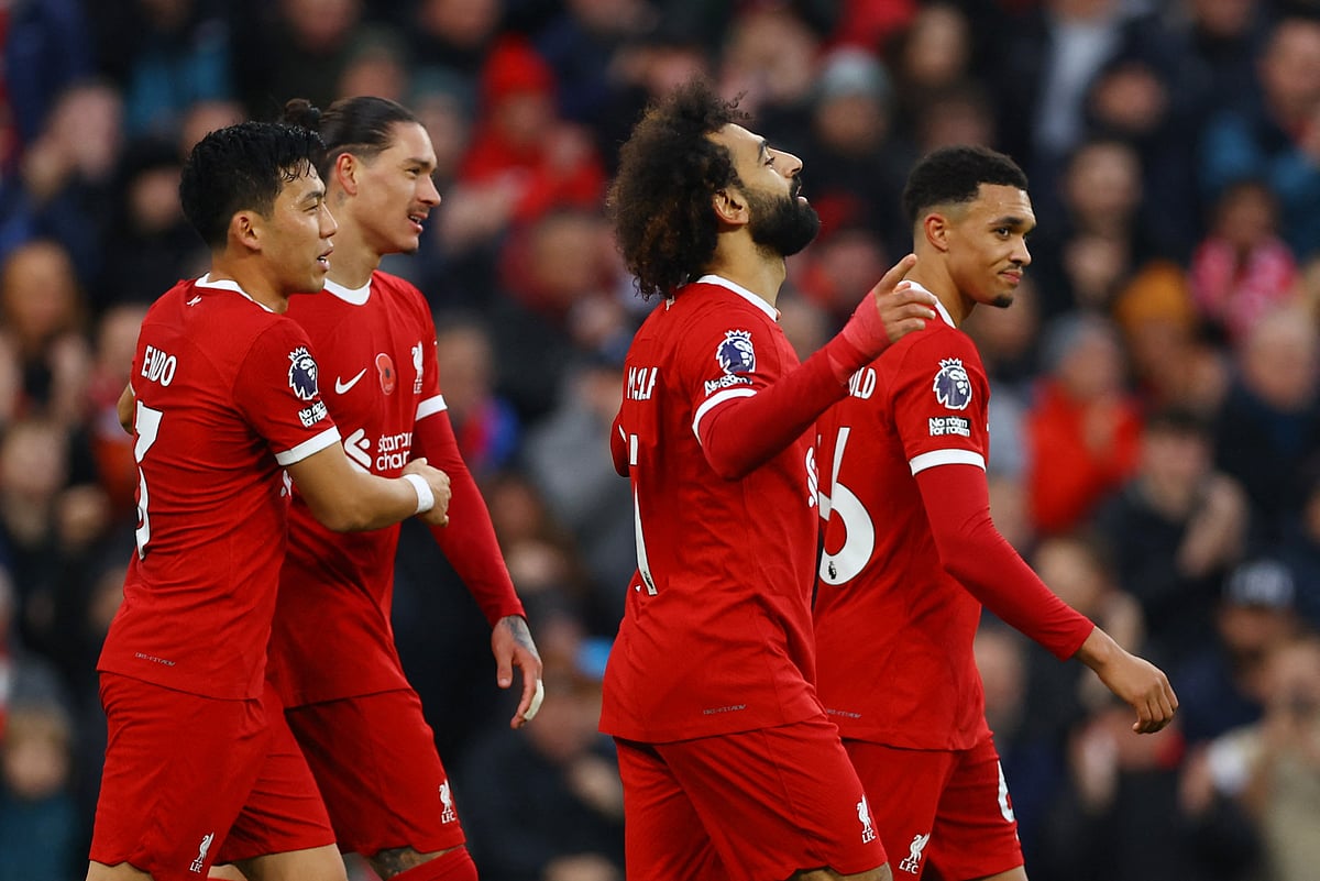 Liverpool's Mohamed Salah celebrates scoring their first goal with Wataru Endo, Darwin Nunez and Trent Alexander-Arnold