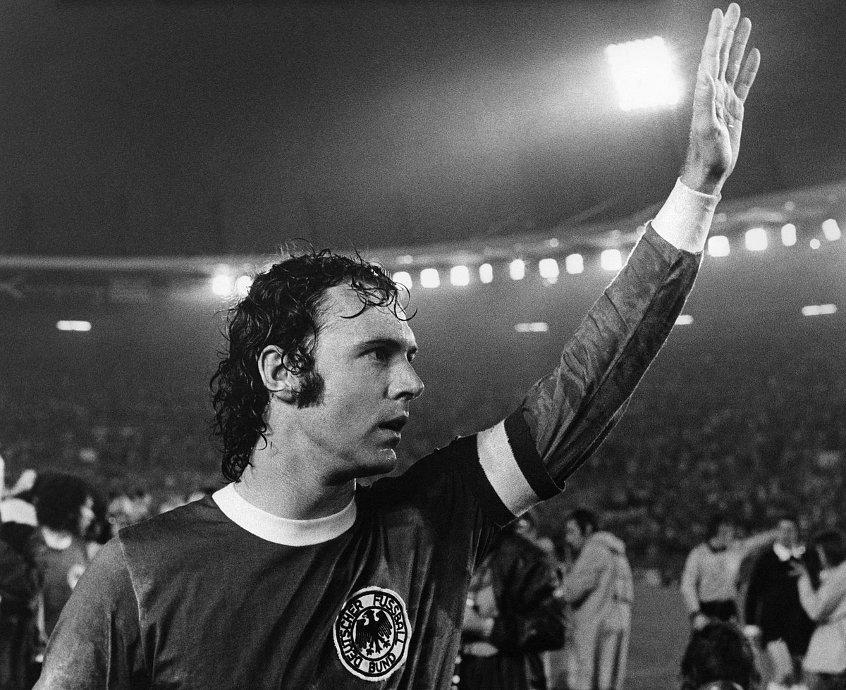 German football player Franz Beckenbauer waves to the spectators after winning the World Cup 1974 final football match against Sweden, in Dusseldorf, on June 30, 1974