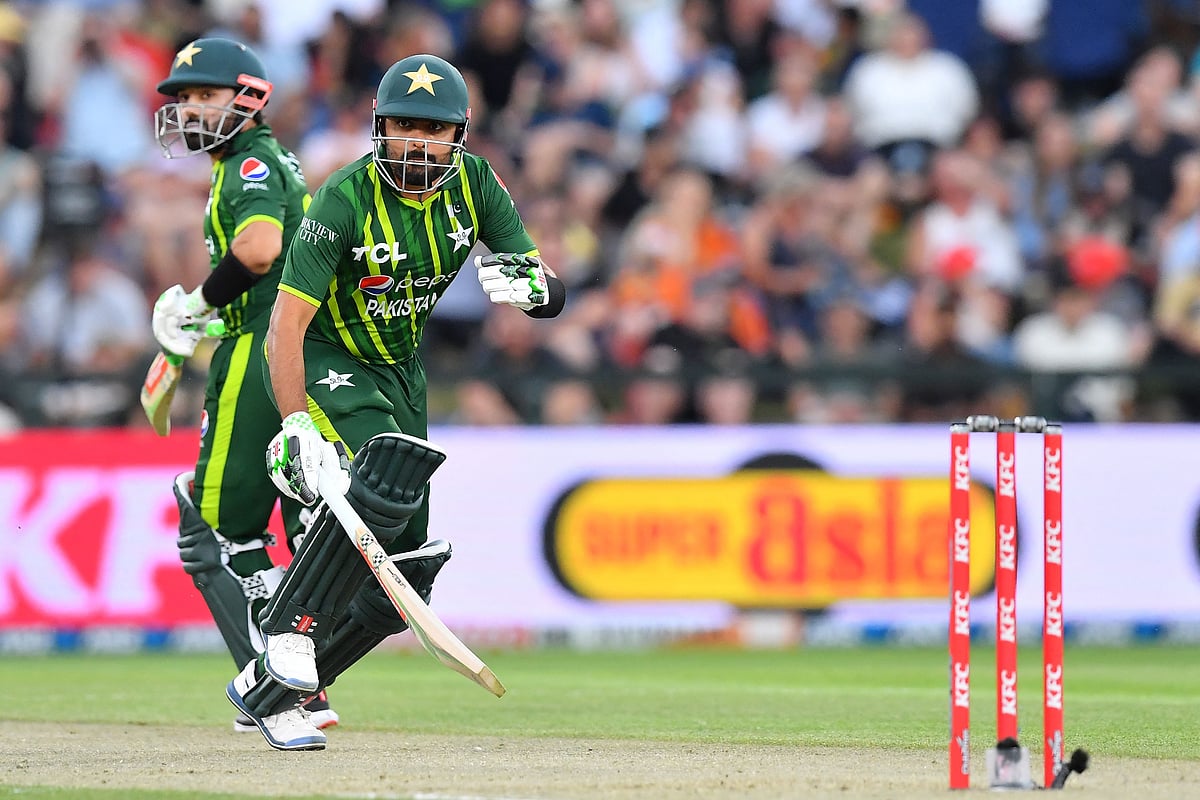Pakistan's Babar Azam (R) and Mohammad Rizwan run between wickets during the fourth Twenty20 international cricket match between New Zealand and Pakistan at Hagley Oval in Christchurch on 19 January, 2024.