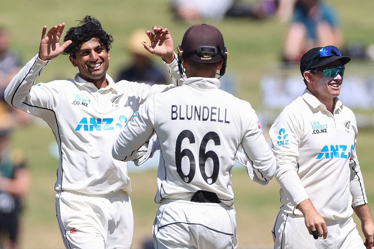 New Zealand’s Rachin Ravindra (L) celebrates the wicket of South Africa's Zubayr Hamza on day one of the second Test cricket match between New Zealand and South Africa at Seddon Park in Hamilton on 13 February 2024.