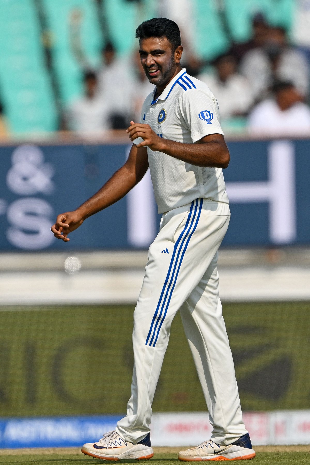India's Ravichandran Ashwin celebrates with teammates after taking the wicket of England's Zak Crawley, his 500th Test wicket, during the second day of the third Test cricket match between India and England at the Niranjan Shah Stadium in Rajkot on 16 February 2024.