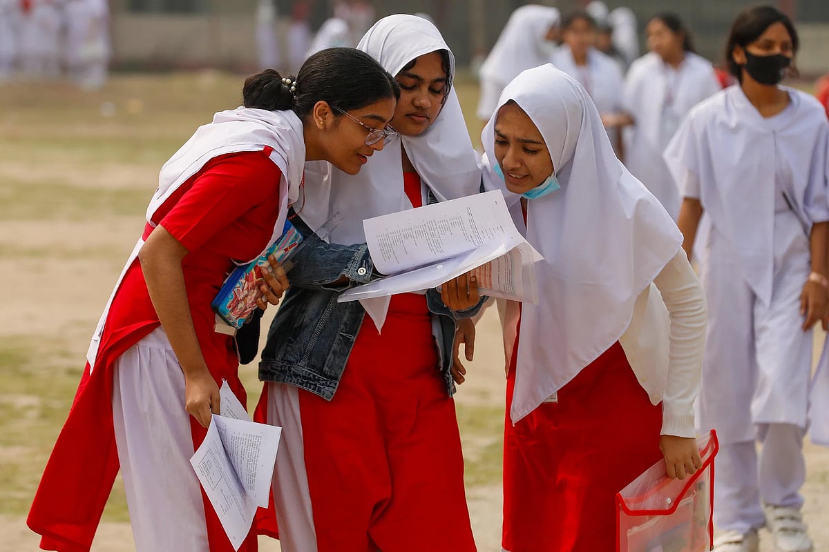 Secondary exams have started across the country. Students compare their answers with each other after getting out of the exam hall. Photo taken from Khulna Zilla School on 15 February.