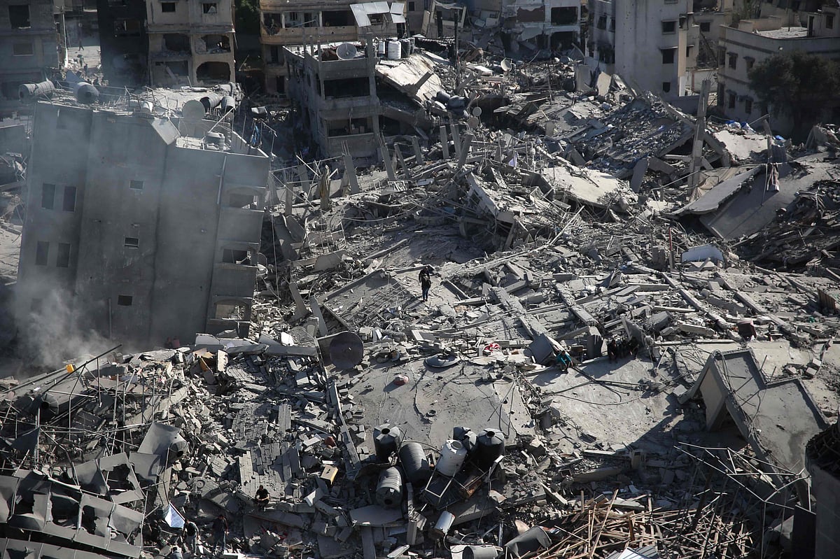 Palestinians inspect the damage in the area around Gaza’s Al-Shifa hospital after the Israeli military withdrew on 1 April, 2024, amid the ongoing battles Israel and the Hamas militant group