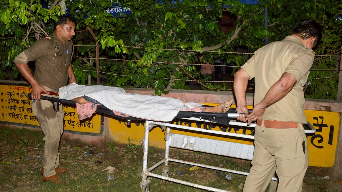 Policemen carry the deceased who died in a melee during a sermon at Hathras in India’s Uttar Pradesh state on 2 July, 2024