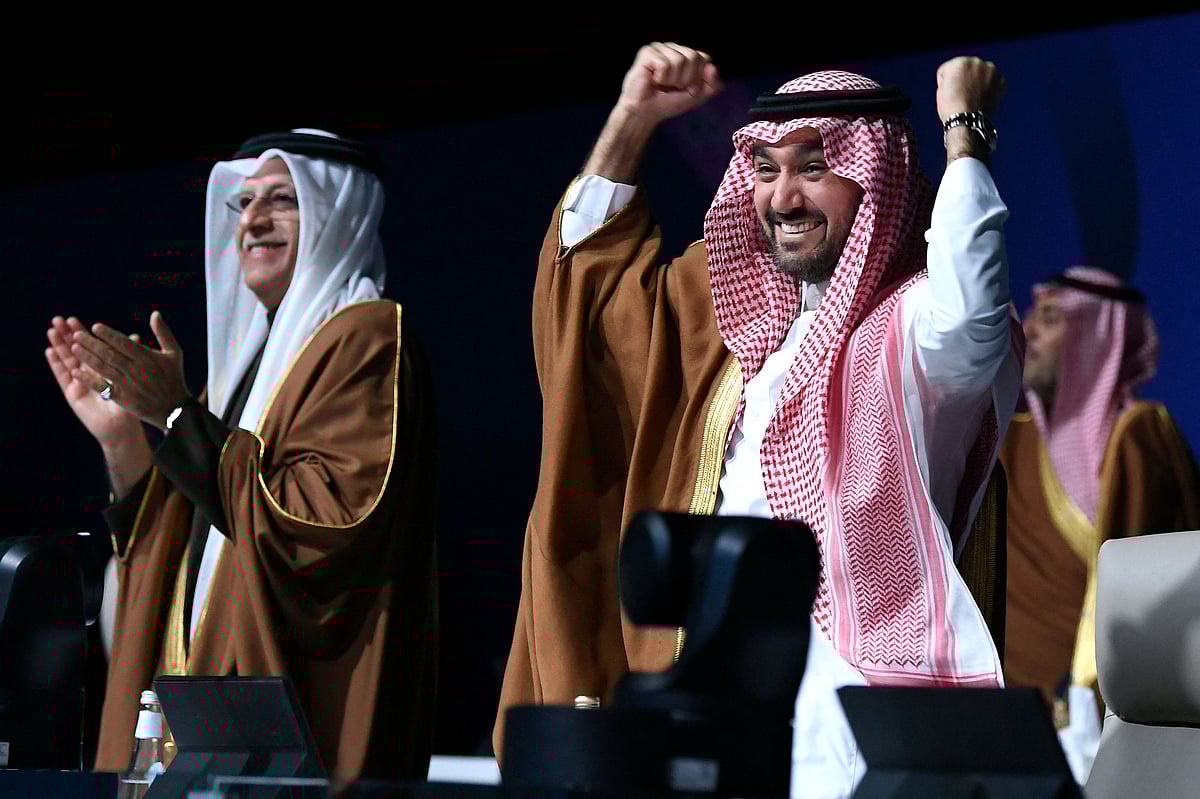 Asian Football Confederation (AFC) President Sheikh Salman bin Ibrahim al-Khalifa (L) and Saudi Arabia’s Minister of Sports and Youth Abdulaziz bin Turki al-Faisal al-Saud celebrate after Saudi Arabia was confirmed as host of the 2034 World Cup during a ceremony in the capital Riyadh on 11 December 2024