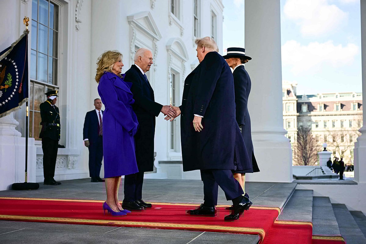 US President Joe Biden and First Lady Jill Biden greet President-elect Donald Trump and Melania Trump as they arrive at the White House in Washington, DC, on 20 January 2025, before departing for the US Capitol where Trump will be sworn in as the 47th US President
