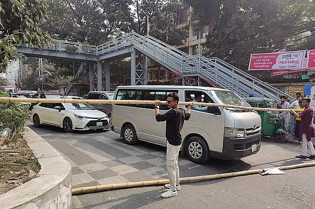 Students of Titumir College have blocked the road in front of the college. The photo was taken from in front of the college at around 12:30pm on Monday.