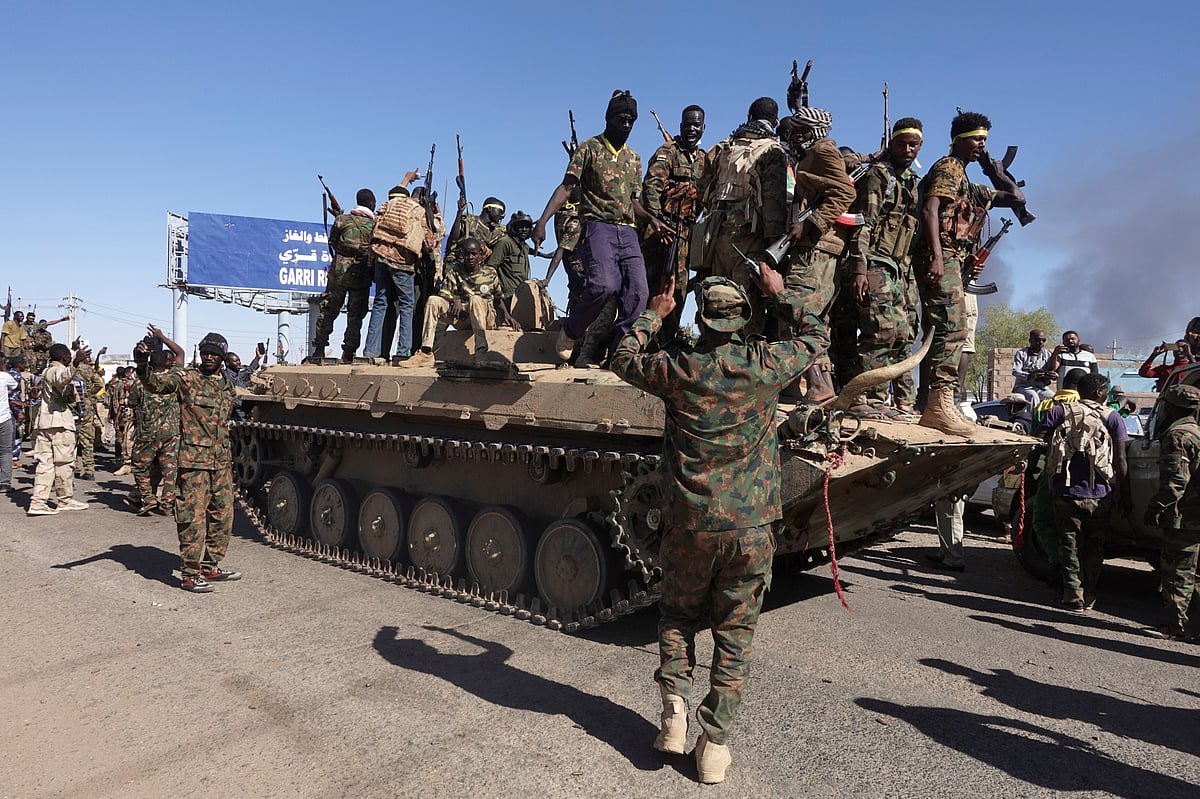 Sudan's army soldiers celebrate the army's liberation of an oil refinery, in North Bahri, Sudan, 25 January, 2025.