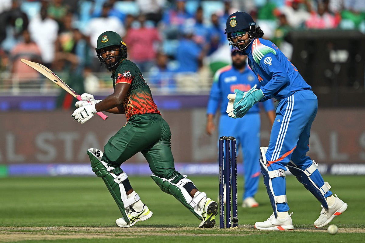 Bangladesh's Jaker Ali (L) plays a shot as India's wicketkeeper KL Rahul watches during the ICC Champions Trophy one-day international (ODI) cricket match between Bangladesh and India at the Dubai International Stadium in Dubai on 20 February 2025