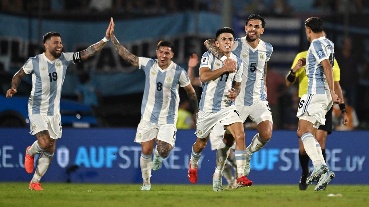 Argentina's midfielder Thiago Almada (3rd R) celebrates with teammates after scoring a goal during the 2026 FIFA World Cup South American qualifiers football match against Uruguay at the Centenario stadium in Montevideo, on 21 March, 2025