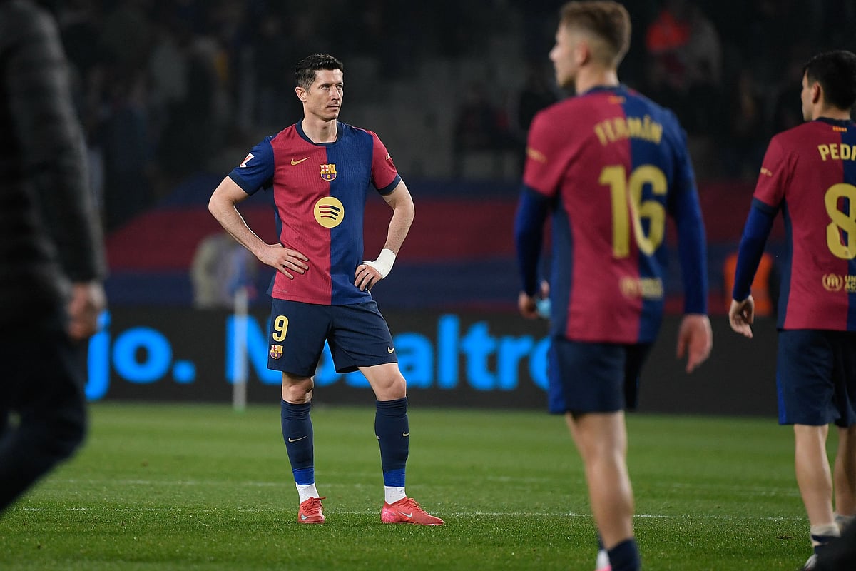 Barcelona's Polish forward #09 Robert Lewandowski reacts at the end of the Spanish league football match between FC Barcelona and Real Betis at the Estadi Olimpic Lluis Companys in Barcelona, on 5 April, 2025.