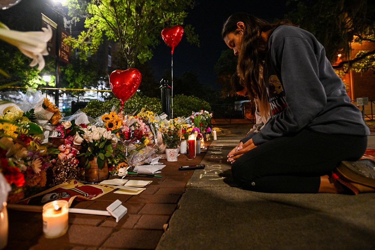 Students hold a vigil near the scene of a shooting near the Florida State University student center on 17 April, 2025 in Tallahassee, Florida. According to reports, two people were killed and several others injured when the alleged shooter, believed to be a current student and the son of a Leon County sheriff deputy, opened fire on the university main campus.