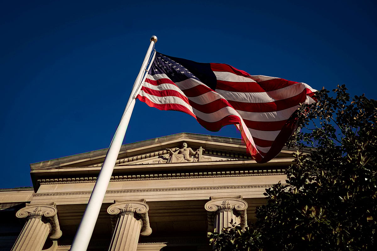 An US flag waves outside the US Department of Justice Building in Washington, US on 15 December 2020.