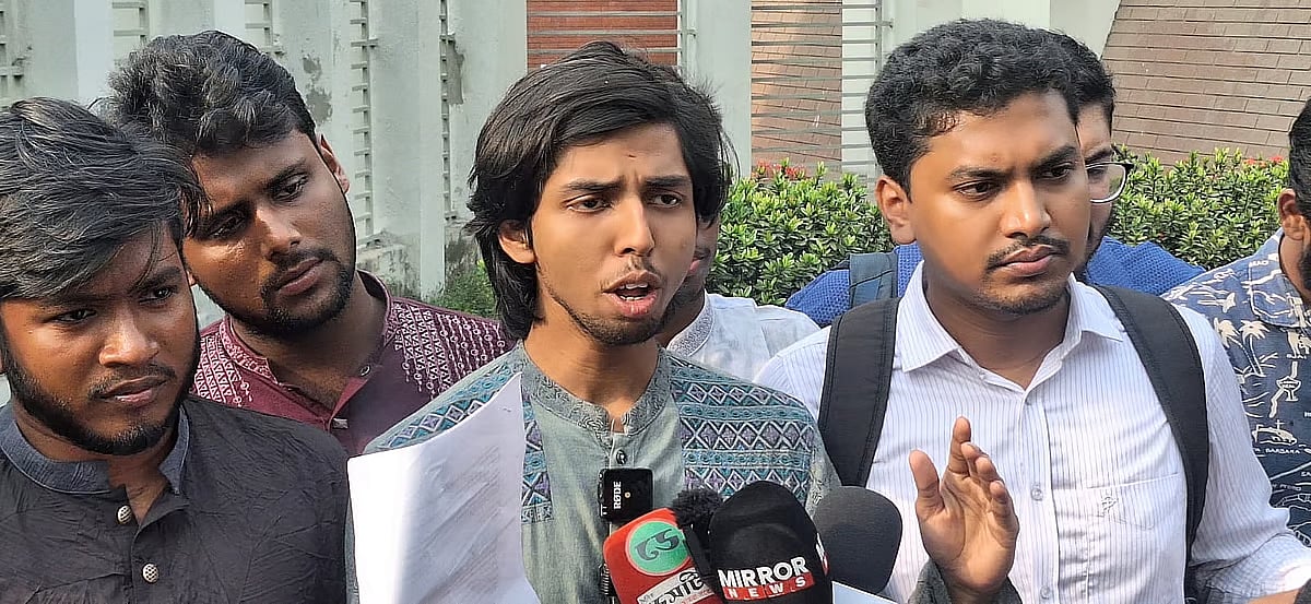 Members of the student delegation speak to journalists after emerging from the Secretariat.