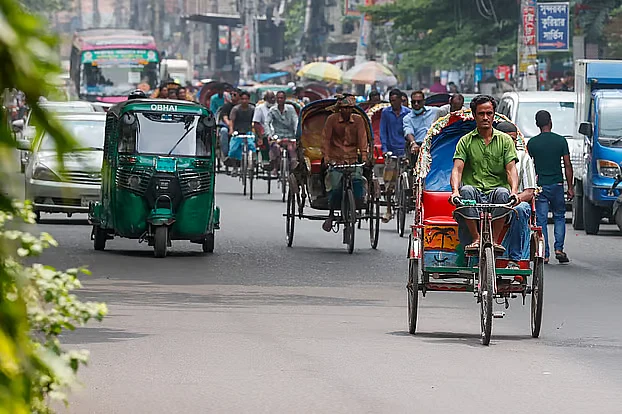 Battery-powered rickshaws running on the main road. Photo taken from Syed nazrul Islam Sharani in Bijoynagar of Dhaka.