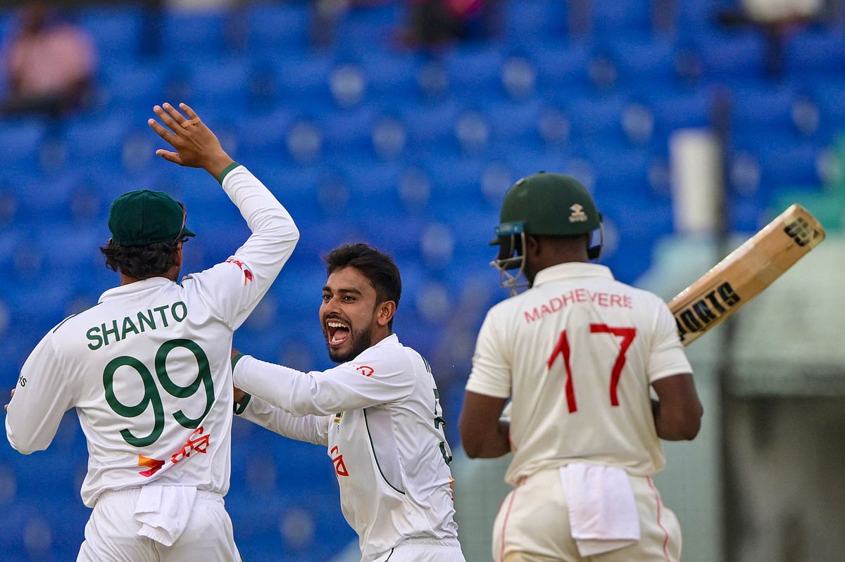 Bangladesh’s Mehidy Hasan Miraz (c) celebrates after the dismissal of the Zimbabwe’s Wessly Madhevere (R) during the third day of the second Test cricket match between Bangladesh and Zimbabwe at a cricket stadium in Chittagong on April 30, 2025.