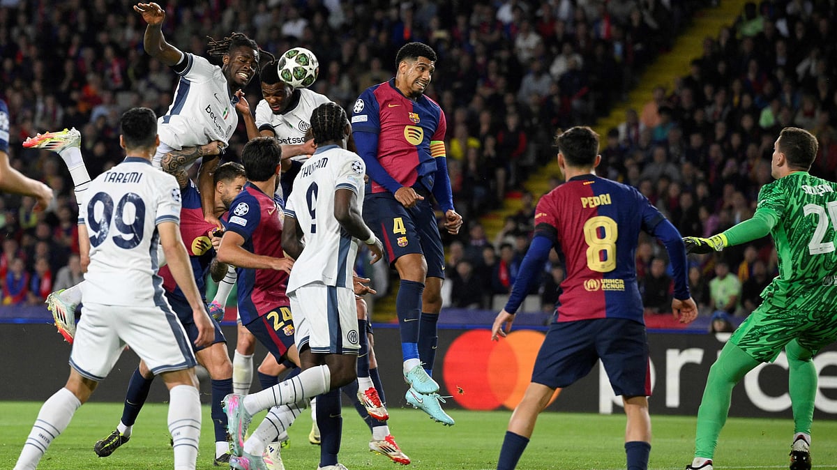 Inter Milan's Dutch defender #02 Denzel Dumfries (2L) scores his team's third goal during the UEFA Champions League semi final first leg football match between FC Barcelona and Inter Milan at the Estadi Olimpic Lluis Companys in Barcelona on 30 April, 2025