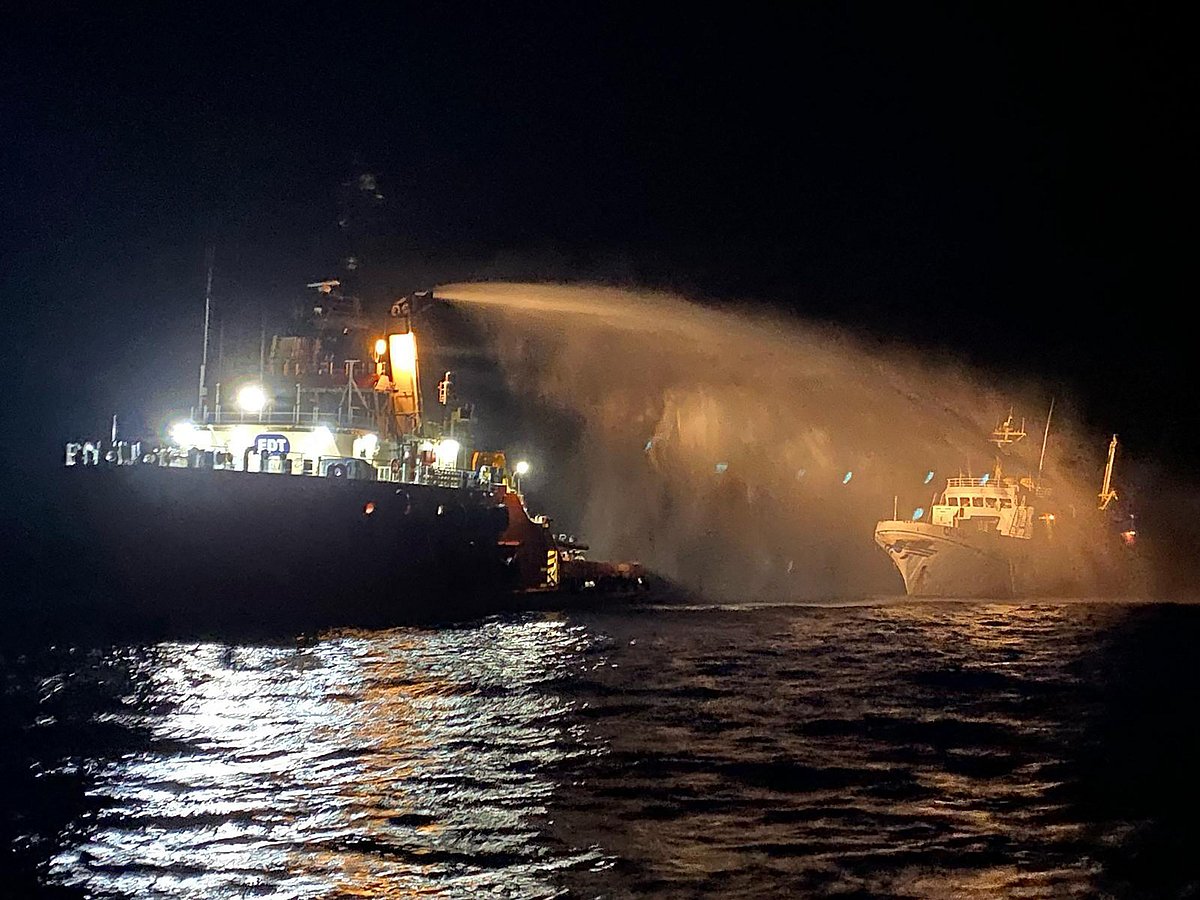 This handout picture released by Malta Government press office on 2 May, 2025 shows a Malta Vessel Traffic Services (VTS) vessel doussing the vessel Conscience (R), after they received a distress call reporting a fire on the bow while outside territorial waters.