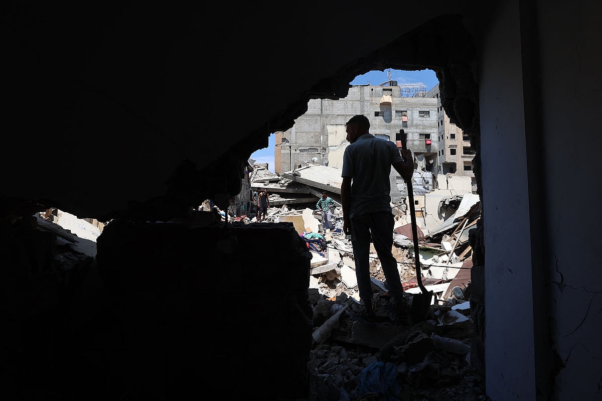 A Palestinian inspects the damage following overnight Israeli strikes, at the Nuseirat refugee camp in the central Gaza Strip on 4 May, 2025