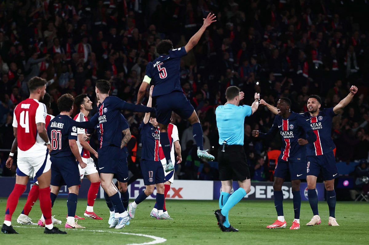 Paris Saint-Germain's Brazilian defender #05 Marquinhos (C) jumps to celebrate after Paris Saint-Germain won during the UEFA Champions League semi-final second leg football match between Paris Saint-Germain (PSG) and Arsenal at the Parc des Princes stadium in Paris, on 7 May, 2025