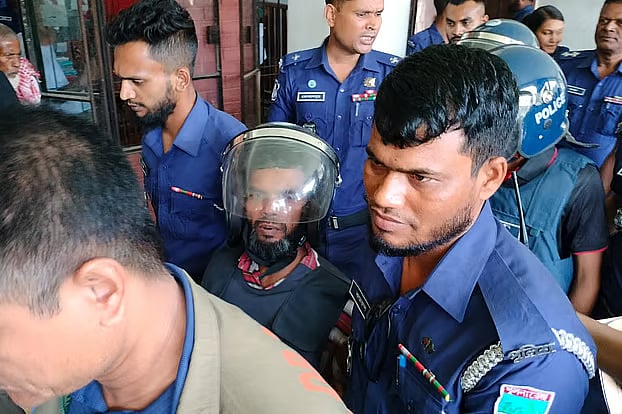 Accused in the case are being taken  back to the prison from the court after the hearing