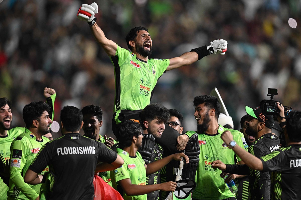 Lahore Qalanders' players carry teammate Sikandar Raza as they celebrate after their victory in the Pakistan Super League (PSL) Twenty20 final cricket match between Lahore Qalandars and Quetta Gladiators at the Gaddafi Stadium in Lahore on 25 May, 2025.