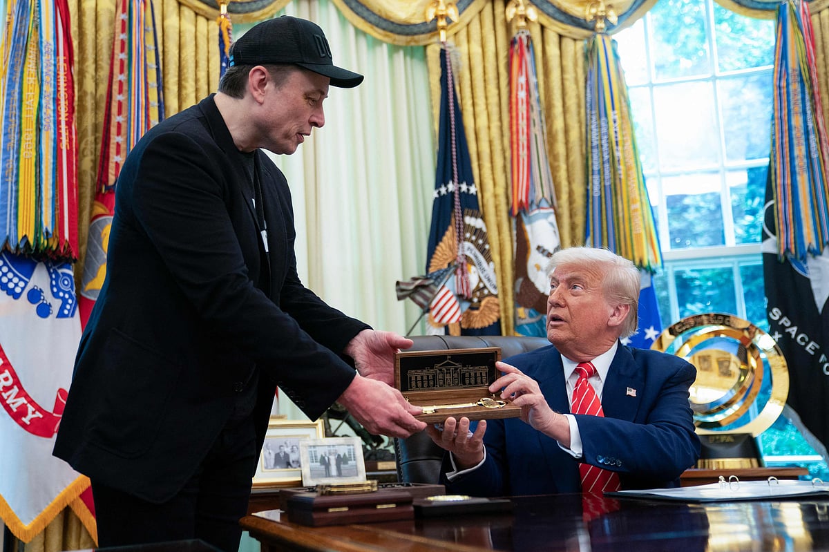 US President Donald Trump gives to Elon Musk a "key to the White House" during a news conference in the Oval Office of the White House in Washington, DC, on 30 May, 2025
