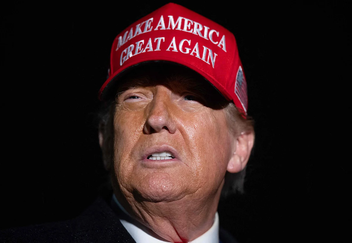 US President Donald Trump speaks to the press in the rain after landing on Air Force One at Joint Base Andrews in Maryland, 30 May, 2025, after traveling to Pennsylvania to visit a US Steel plant.