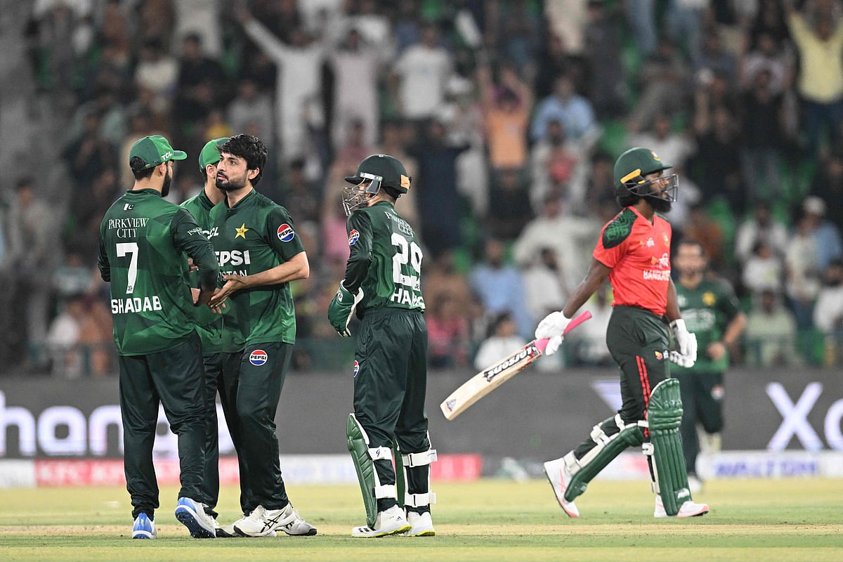 Pakistan's Abrar Ahmed (2L) celebrates with teammates after taking the wicket of Bangladesh's Jaker Ali (R) during the second Twenty20 international cricket match between Pakistan and Bangladesh at the Gaddafi Cricket Stadium in Lahore on 30 May, 2025.