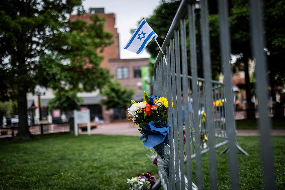 Flowers and a flag at the site of the attack outside the Boulder County Courthouse on June 2, 2025 in Boulder, Colorado.