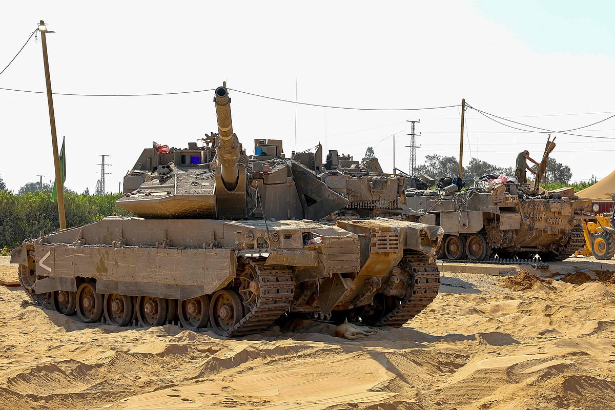 An Israeli soldier stand atop a tank at a position along the Israeli border with the Gaza Strip on June 5, 2025, amid the ongoing war between Israel and the Palestinian group Hamas.