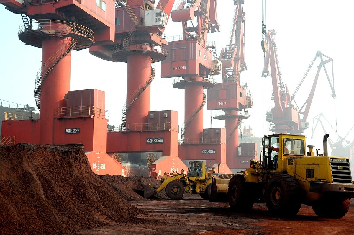 Workers transport soil containing rare earth elements for export at a port in Lianyungang, Jiangsu province, China on 31 October 2010.