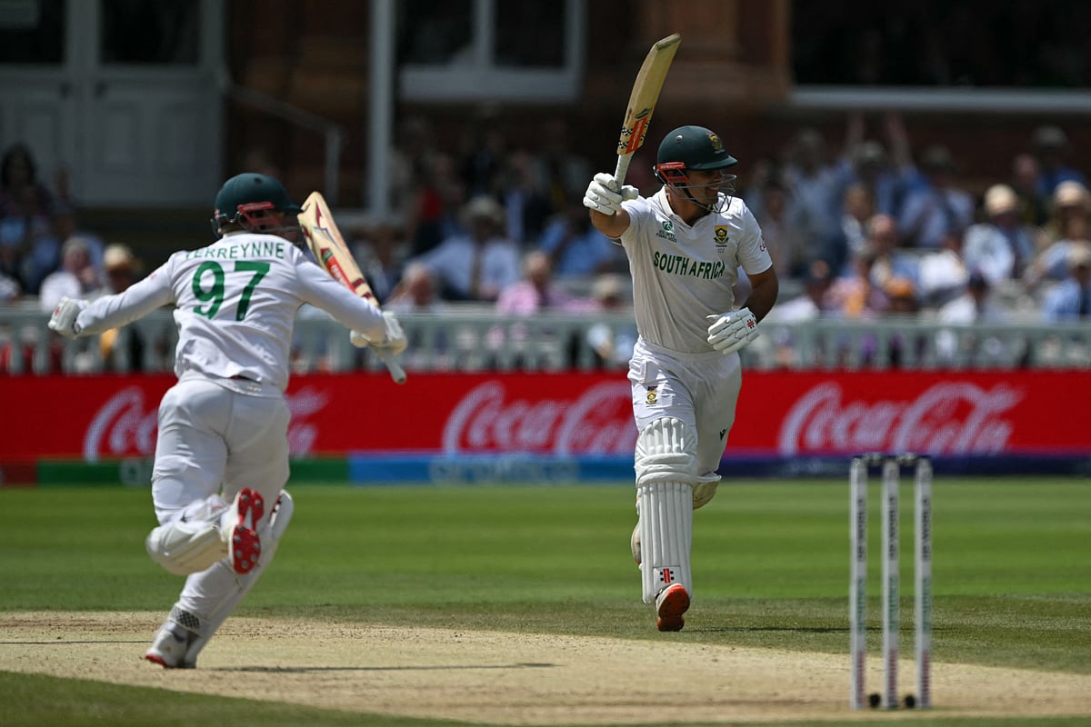South Africa's wicket keeper Kyle Verreynne (L) and South Africa's David Bedingham (R) celebrate victory on day four of the ICC World Test Championship cricket final match between Australia and South Africa, at Lord's cricket ground, in London, on 14 June, 2025.