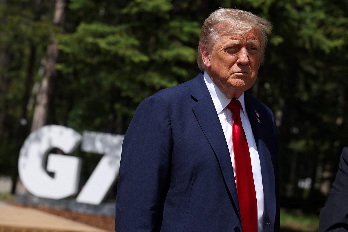 US President Donald Trump speaks to reporters with the British prime minister (out of frame) during the Group of Seven (G7) Summit at the Pomeroy Kananaskis Mountain Lodge in Kananaskis, Alberta, Canada on June 16, 2025