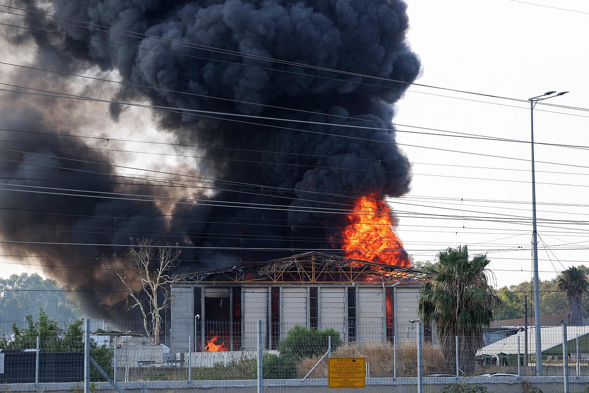 Smoke plumes arise from the Islamic Republic of Iran Broadcasting (IRIB) corporation building in the north of Tehran after it was hit by an overnight Israeli strike on 17 June, 2025