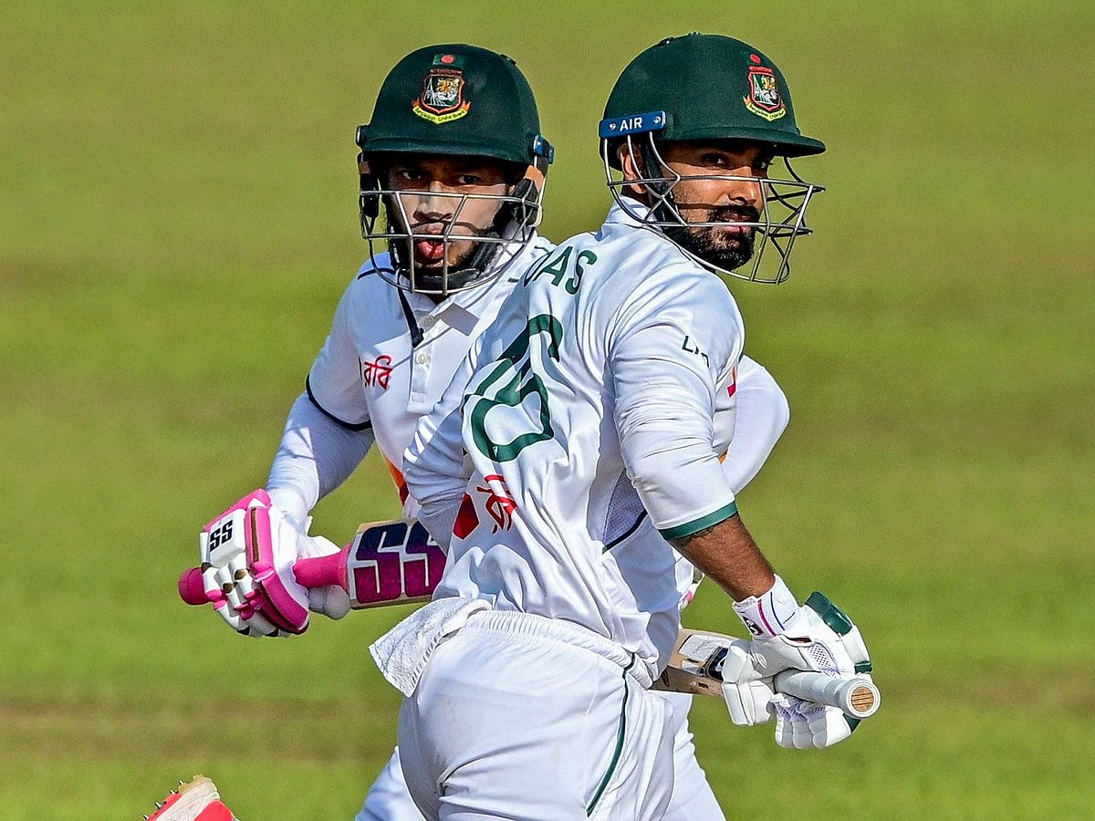 Mushfiqur Rahim (L) and Litton Das run between the wickets during the second day of the first Test cricket match between Sri Lanka and Bangladesh at the Galle International Cricket Stadium in Galle on 18 June, 2025.