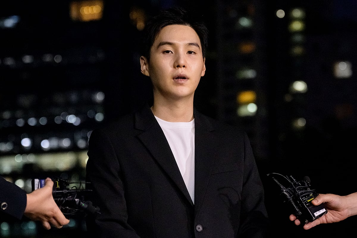 South Korean singer Suga of K-pop mega group BTS arrives at a police station in the Yongsan district of Seoul on 23 August, 2024, for questioning after being charged with riding an electric scooter while under the influence late night on 6 August. SUGA, a member of the K-pop megaband BTS, will officially complete his mandatory military service on 21 June, 2025, marking the full return of all seven members of the global supergroup from duty.