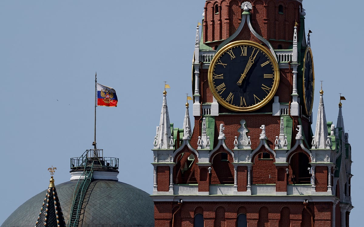 The Russian flag flies on the dome of the Kremlin Senate building behind Spasskaya Tower in Moscow, Russia on 2 June 2025.