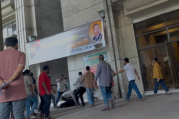 A man is being beaten up in the Nagar Bhaban on 24 June 2025.