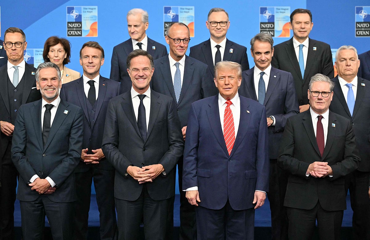 Finland's President Alexander Stubb, Netherlands' Prime Minister Dick Schoof, France's President Emmanuel Macron, NATO Secretary General Mark Rutte, US President Donald Trump, Greece's Prime Minister Kyriakos Mitsotakis, Britain's Prime Minister Keir Starmer, Hungary's Prime Minister Viktor Orban stand with NATO country leaders for a family photo during the North Atlantic Treaty Organization (NATO) Heads of State and Government summit in The Hague, on June 25, 2025. NATO leaders hold a two-day summit on 24 and 25  June in The Hague.