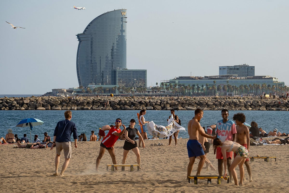 This image shows people at Barceloneta beach in Barcelona, on 27 June 2025, a day before the first heatwave of the year is officially expected to begin.