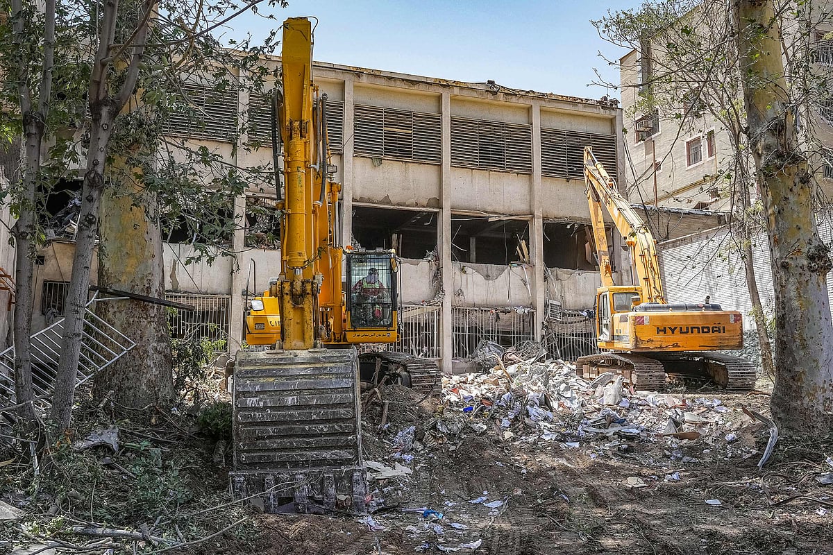 In this picture obtained from the Iranian judiciary's news agency Mizan Online on 25 June, 2025, excavators are used to clear the rubble outside the Evin prison complex in Tehran that was hit days ago by an Israeli strike.
